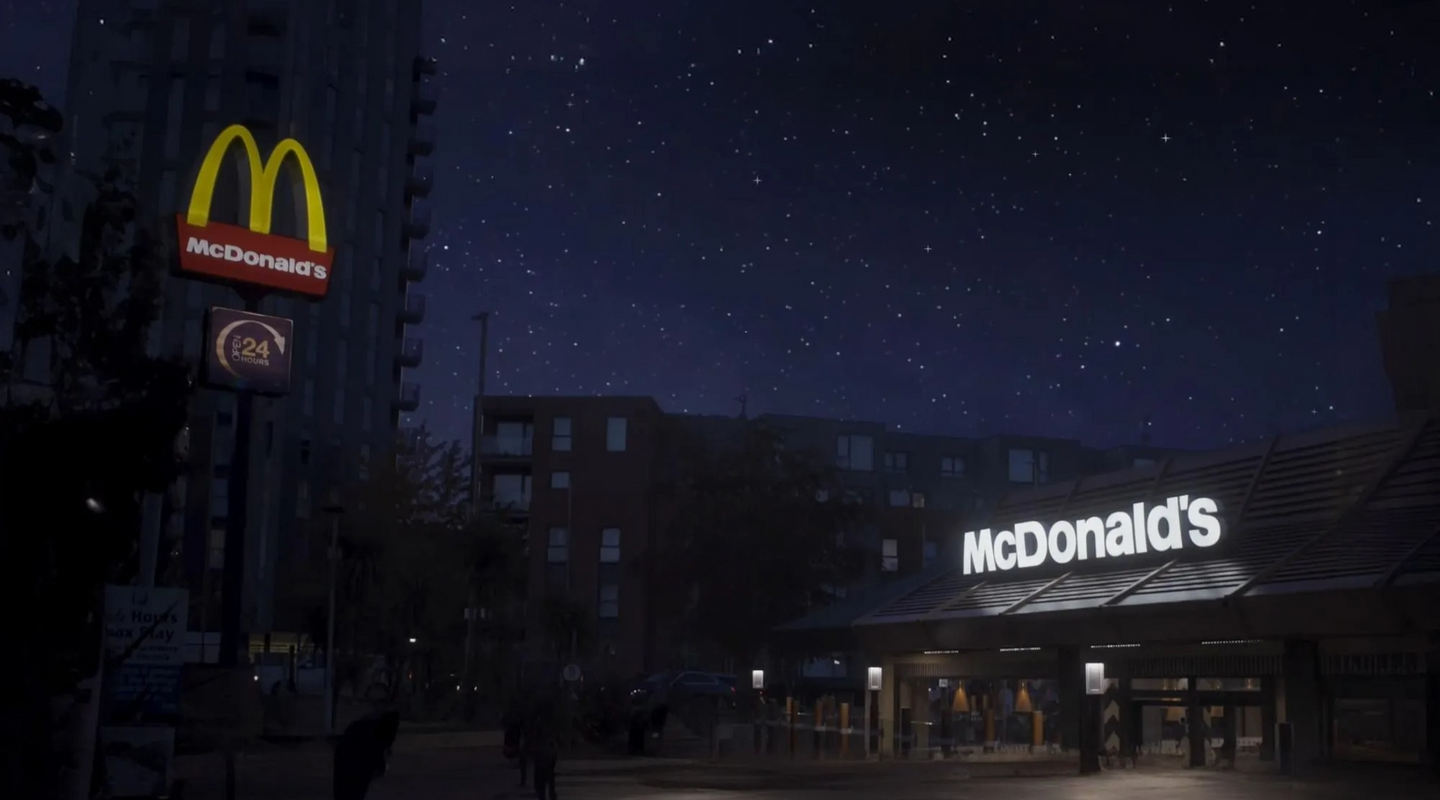 Outside a McDonald's restaurant at night with stars in the sky.
