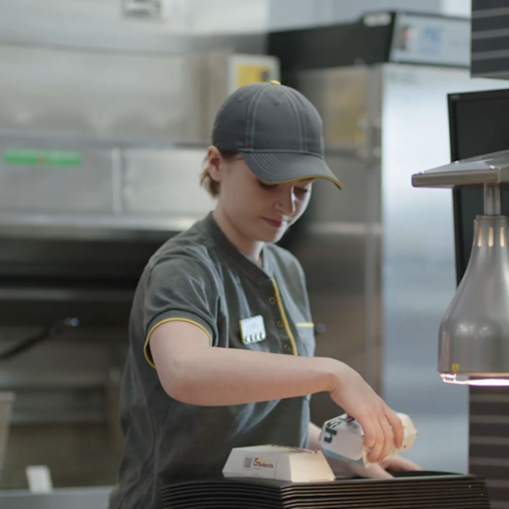 Young woman placing food