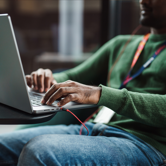 Man typing on laptop