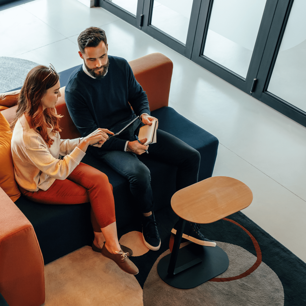 man and woman at desk