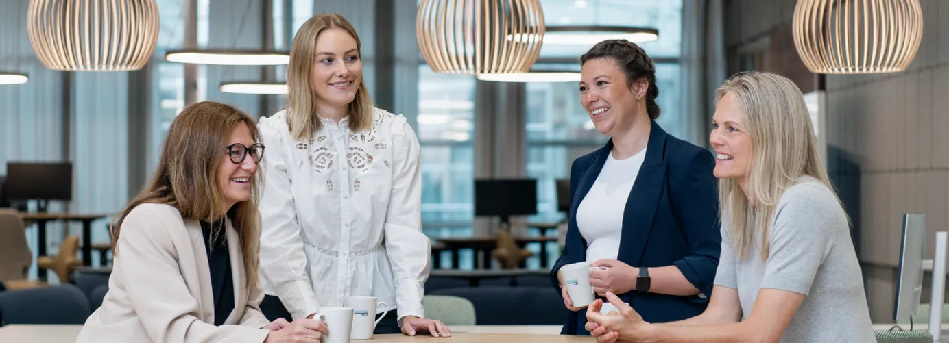 women at table smiling